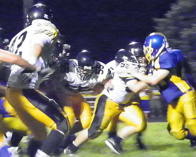 Viking linemen lead the way to the end zone.