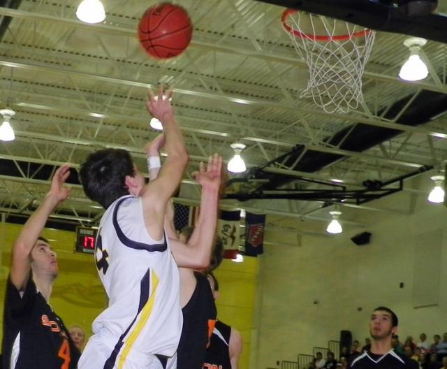 Grant Sagan attempts a first half layup vs. Solon.