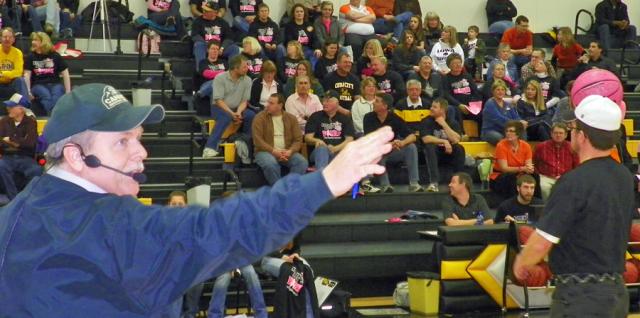 Darrell Cannon accepts bids during the Pink Night auction.