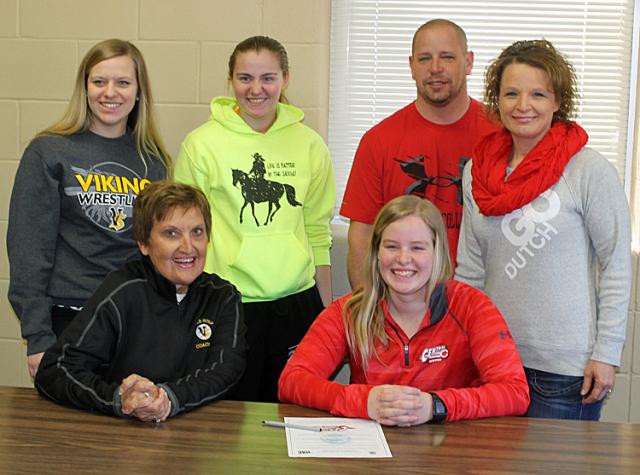 Teammate Lauren Tandy and friend Keri Webster joined the Walkers and Coach Woodhouse at the signing.