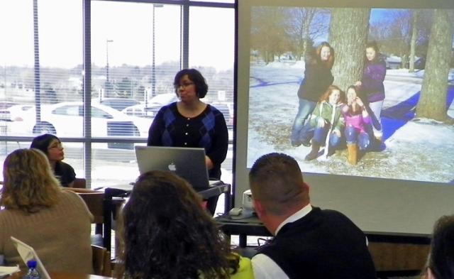 Mrs. H-V introduces the walnut debate during the school board meeting.