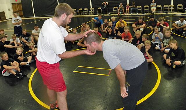 Coaches James Locke and Joel Neve demonstrate the best grips to employ.