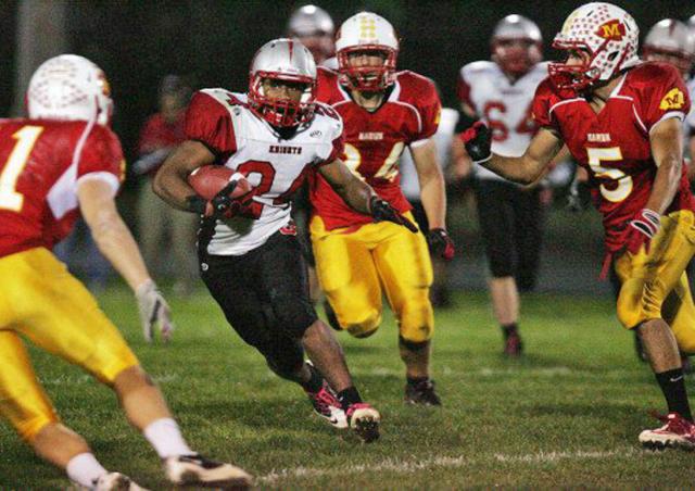 Wes Burnside carries the ball vs. Marion in last year's Union victory..
